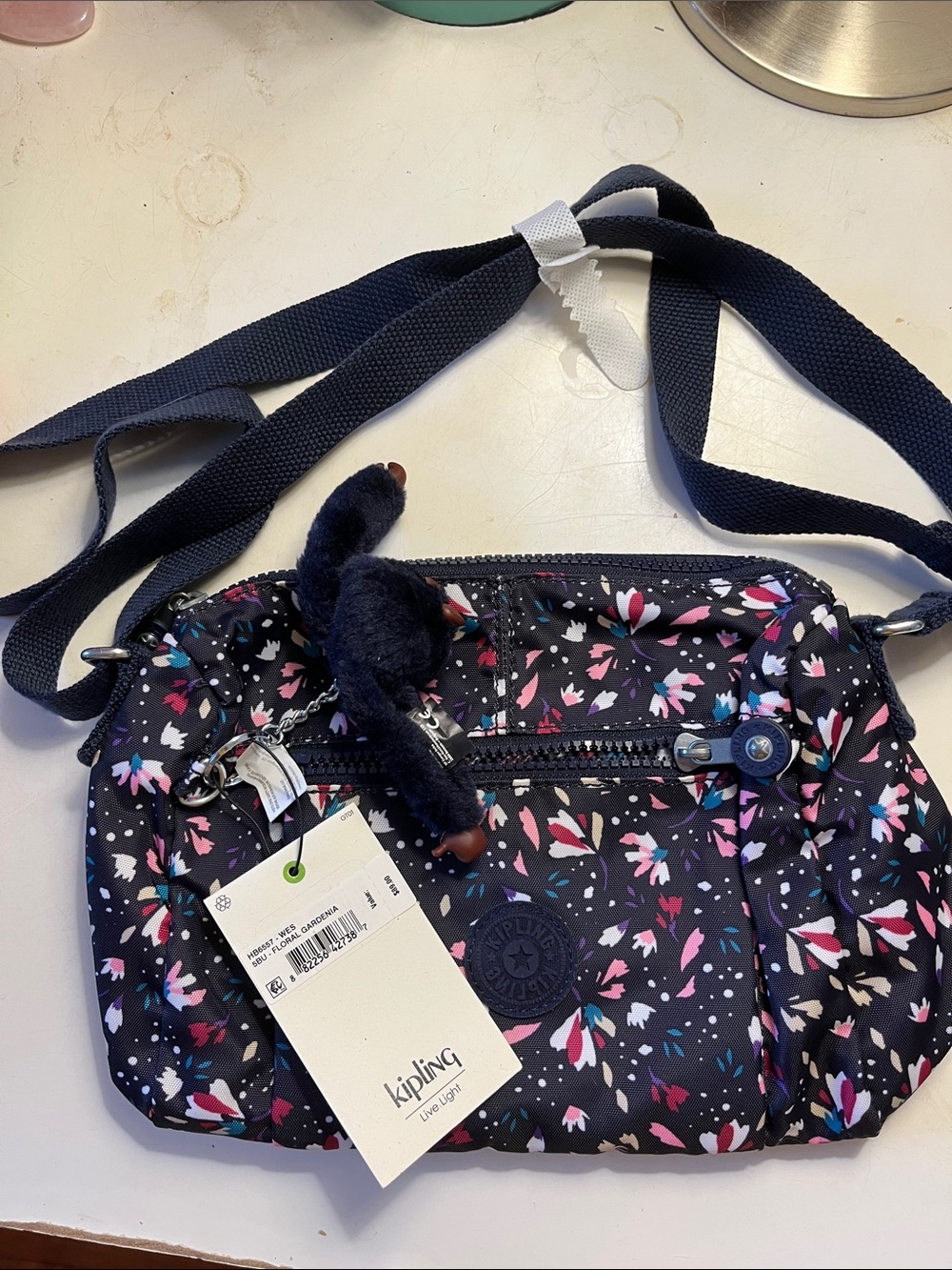 Kipling Black Floral Crossbody with Pink and Blue Accents